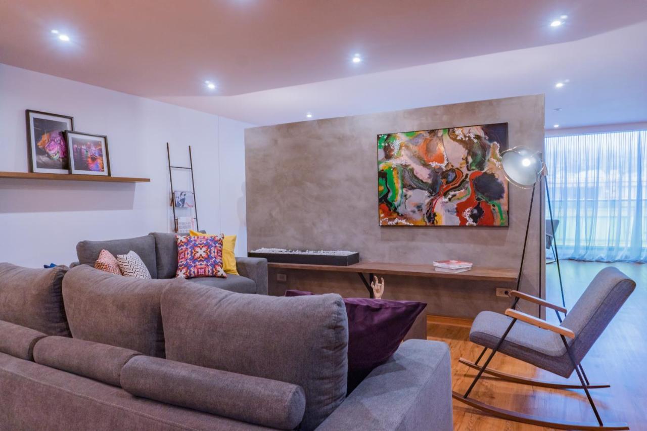 Hotel V1501 Pasto Esterno foto A living room with a concrete wall