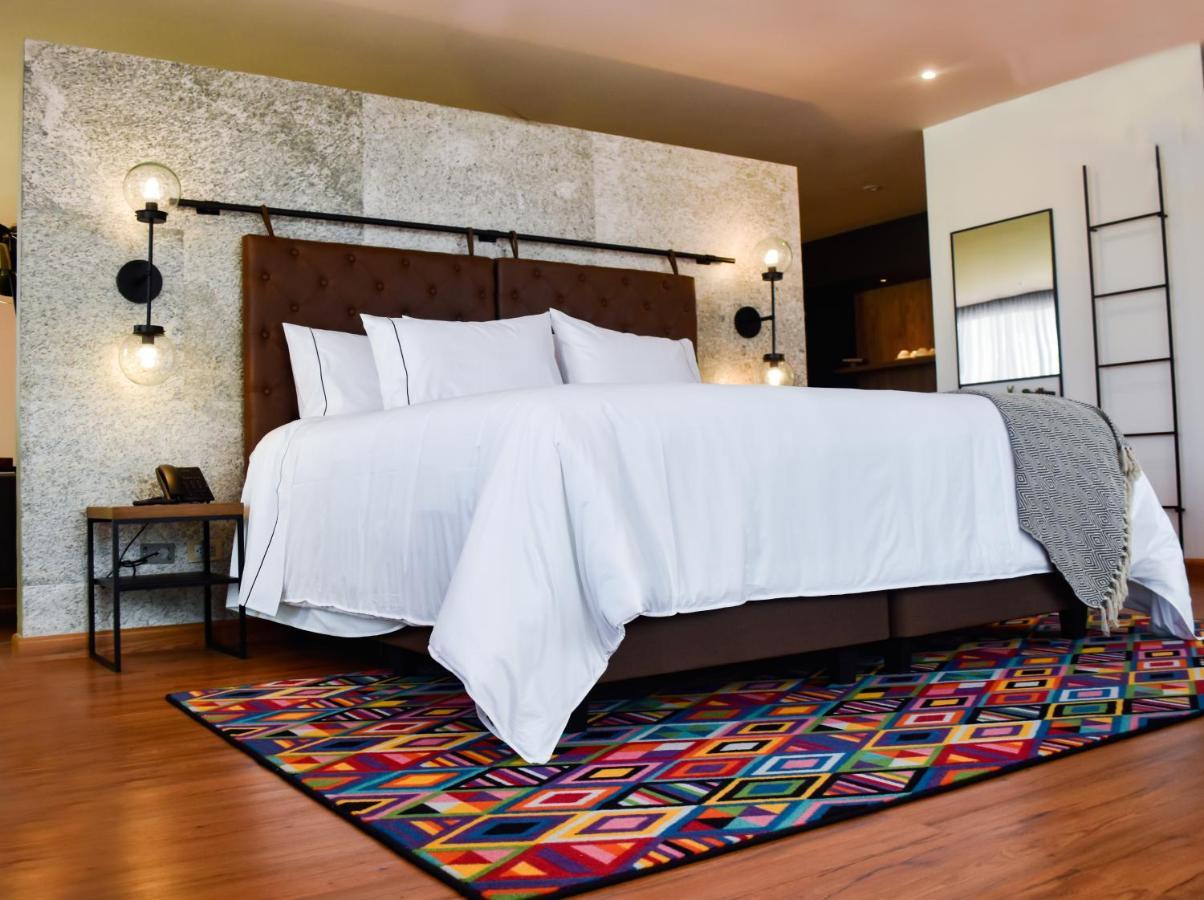 Hotel V1501 Pasto Esterno foto A bedroom with a carpet