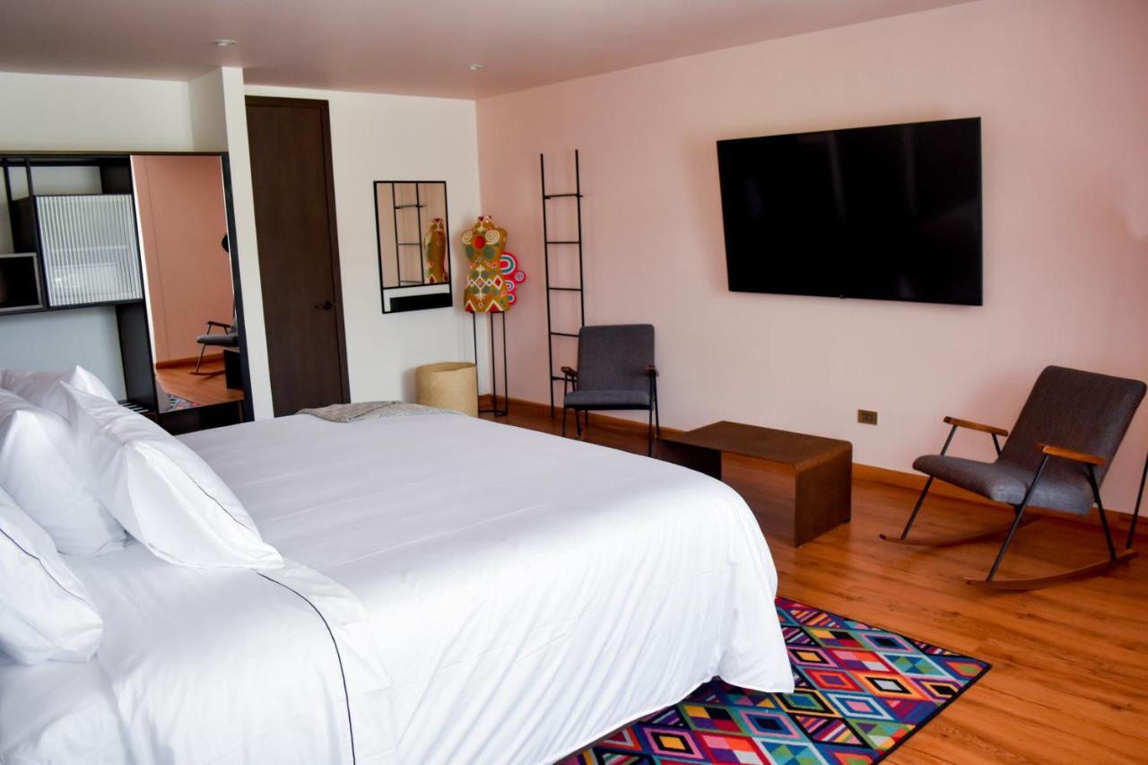 Hotel V1501 Pasto Esterno foto A room at the hotel
