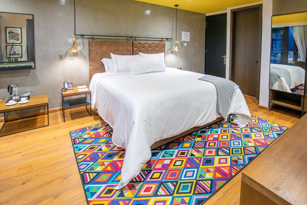 Hotel V1501 Pasto Esterno foto A carpet in a bedroom