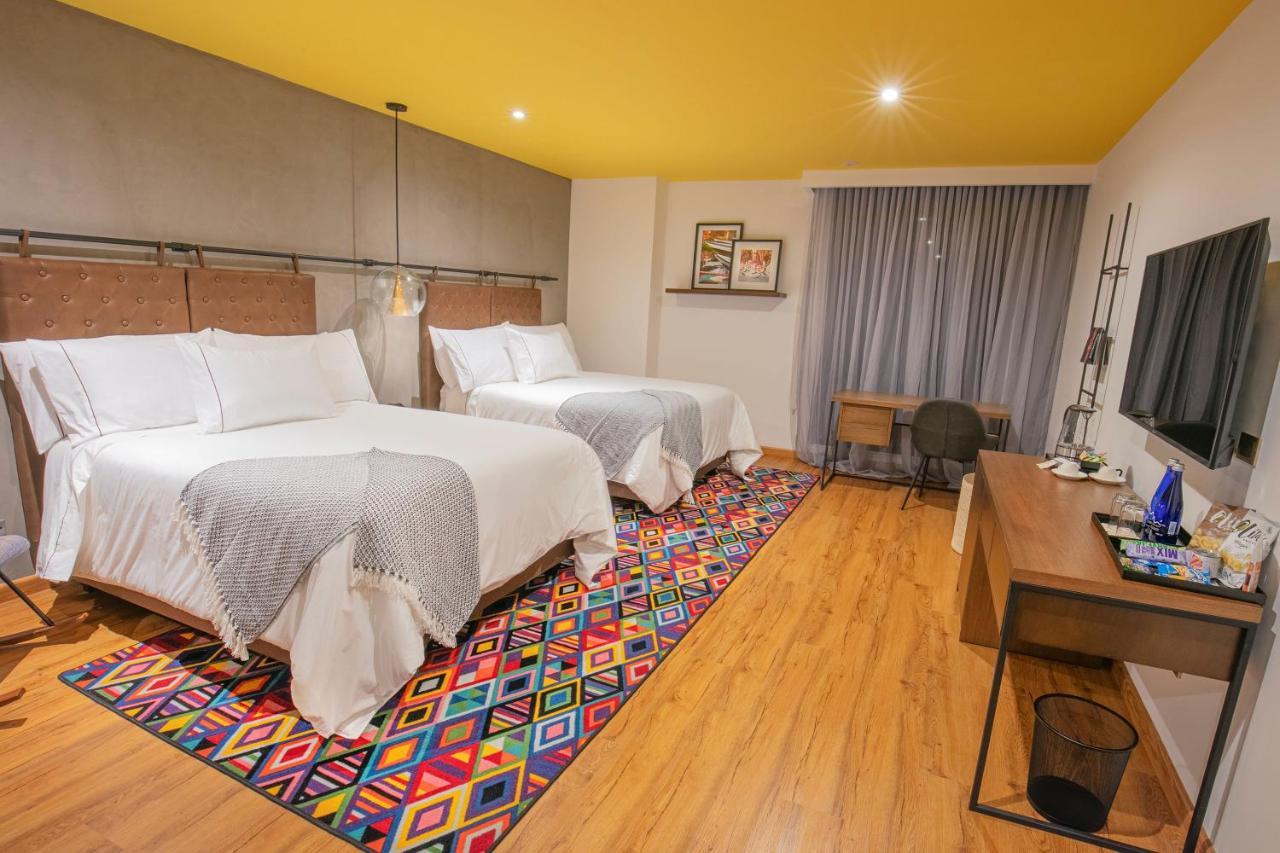 Hotel V1501 Pasto Esterno foto A room at the hotel