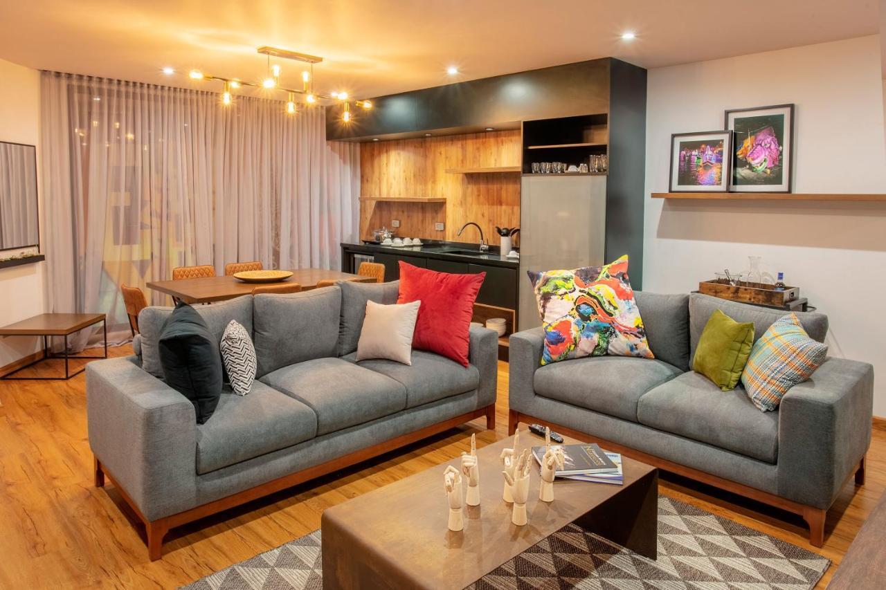 Hotel V1501 Pasto Esterno foto A living room with a sofa